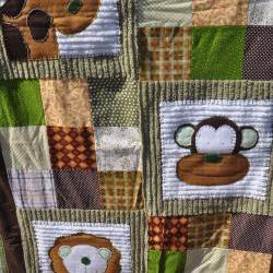 monkey, lion, and girraffe crib quilt